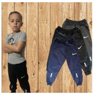 Calça nk Nikke Infantil e adulta Jogger Promoção Envio Imediato Preta Cinza e Marinho Logo Swoosh Refletivo
