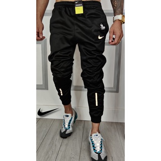 Conjunto Jaqueta Nike Dri Fit Touca e Bolso Corta Vento + Calça Jogger Refletiva Símbolo Pequeno (4)