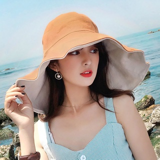 A aba de grandes dimensões cobre o rosto, chapéu de sol, menina da moda, protetor solar de verão, chapéu de pescador versátil